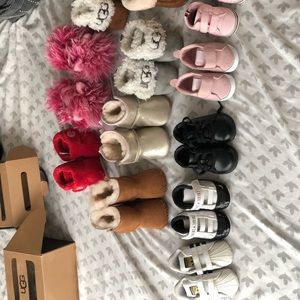 Variety of different  name brand toddler shoes.
